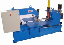 Machine to Cut discs with loading and unloading by robot.